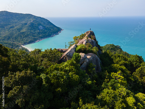 Aerial drone view at bottle beach view point with turquoise water trees and hills in Koh Phangan Thailand