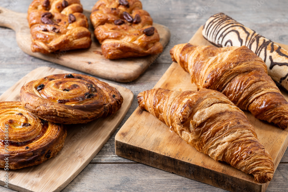 Fototapeta premium Set of bakery pastries on wooden table