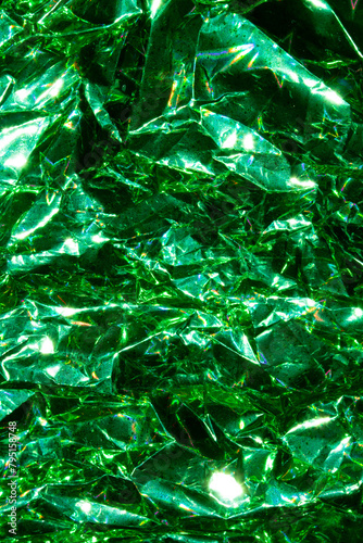 Holographic Crumpled  Green Paper Material which is Shiny for Background photo