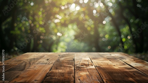 Sunlight filtering through trees onto wooden tabletop photo