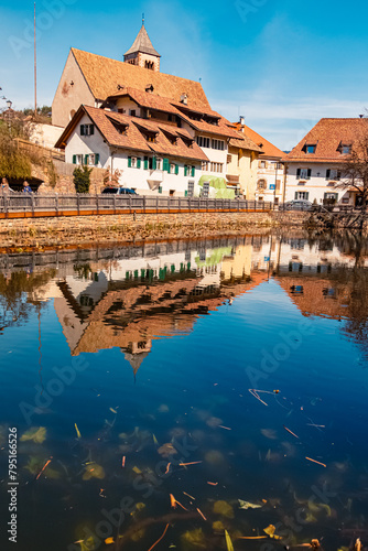 Alpine spring view with reflections in a pond near Klobenstein, Ritten, Eisacktal valley, South Tyrol, Italy