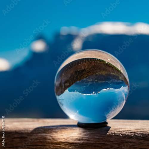 Crystal ball alpine landscape shot with Mount Schlern, dolomites, in the background near Klobenstein, Ritten, Eisacktal valley, South Tyrol, Italy