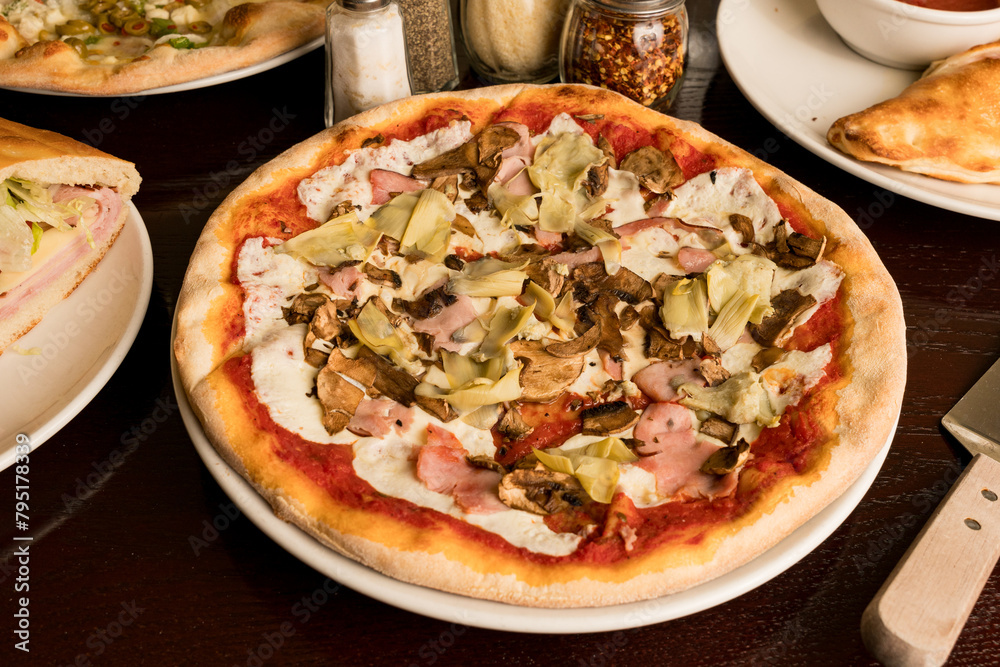 Pizza with artichokes and ham