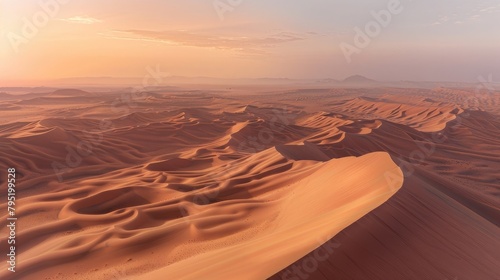 A vast desert landscape stretching to the horizon  where sand dunes ripple like waves in the endless sea of sand.
