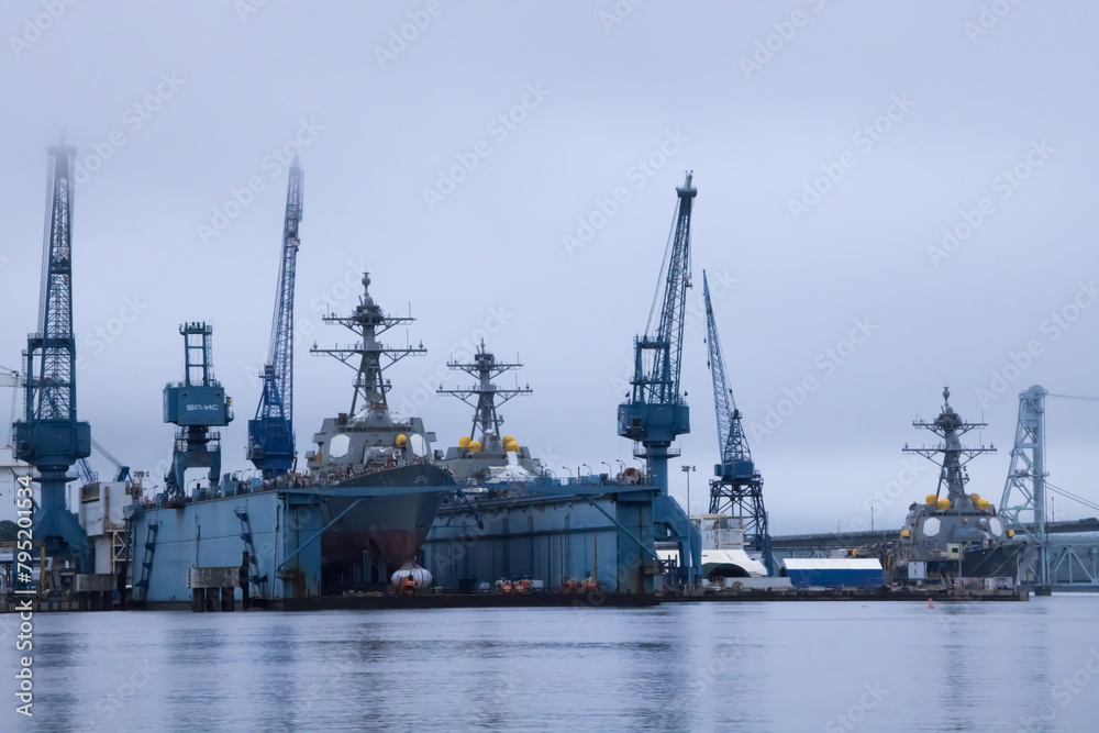 Battleship in port to be worked on Battleship in port to be worked on