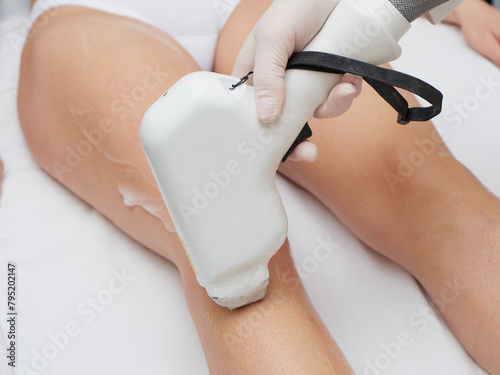 Beautician Removing Hair Of Young Woman’s body