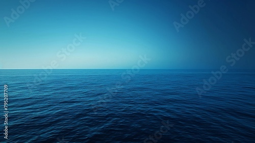 The clear blue ocean stretches infinitely under a bright sky, symbolizing freedom and the vastness of nature. photo
