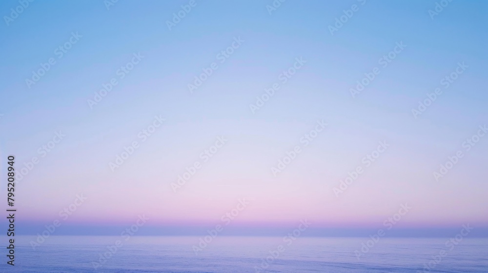 The tranquil ocean meets a pastel dawn sky in a perfect blend, creating a soft, serene horizon that soothes the soul.