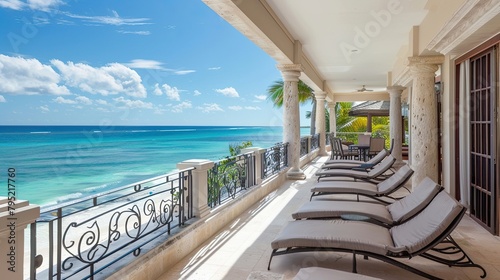 Spacious balcony overlooking the ocean and comfortable sun lounger. Luxury, splendor, sea, beach, shore, vacation, landscape, tropics, resort. Advertising image concept for hotels. Generative by AI