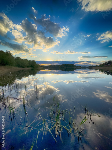 Serene Fishing Lake: A peaceful scene by the tranquil waters of a secluded fishing lake