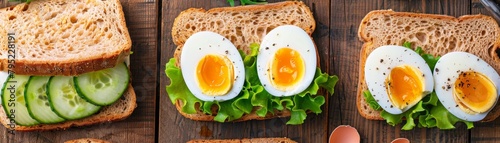 A variety of open-faced sandwiches made with bread, lettuce, cucumber, and hard-boiled eggs.