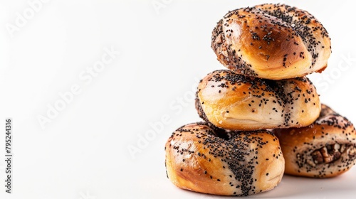 Insulated buns made of yeast dough with black poppy seeds. Poppy seed filling full of nuts and dried fruits. Sweet and appetizing, baked in small, wrapped pieces. stacked cake on a white background