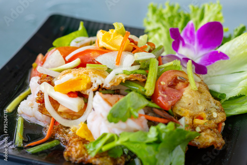 Fried egg salad with vegetables and fresh shrimp