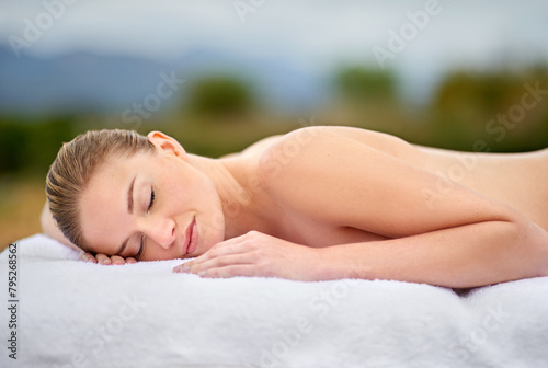 Woman  relax and massage table in spa  therapy and self care for body wellness and resting for tension. Comfortable and resort with client  stress free and healing  calm session and cosmetology