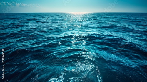 Blue-green surface of the ocean in Catalina Island, California, with gentle ripples on the surface and light refracting