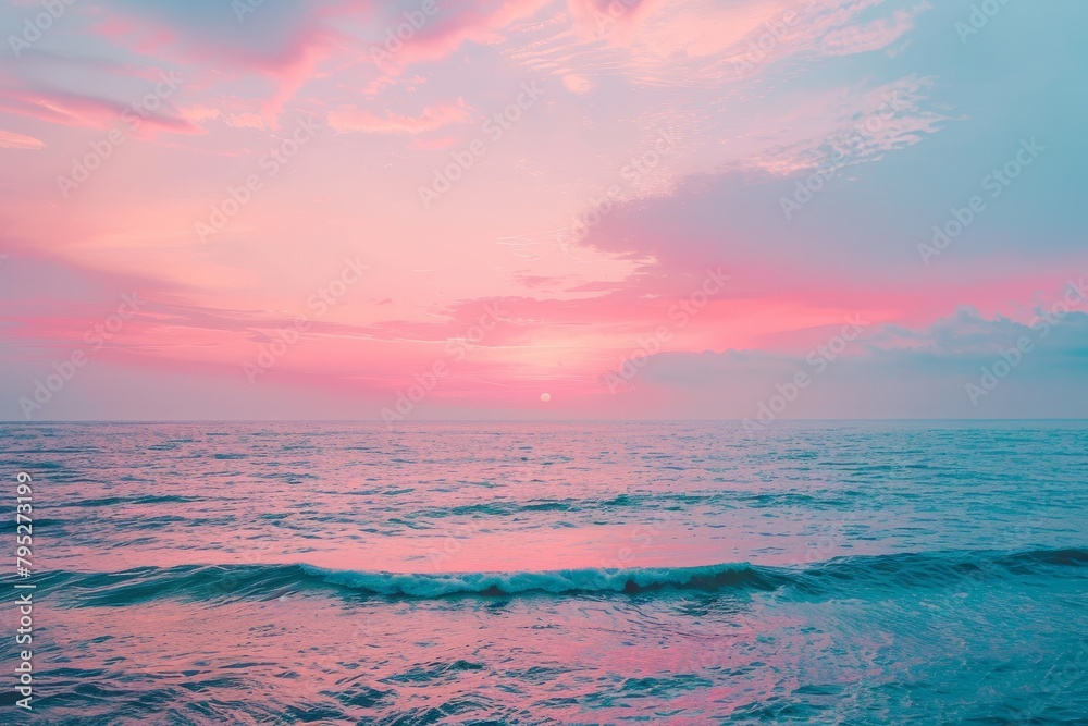 Serene Pink Sunset Over Ocean Waves