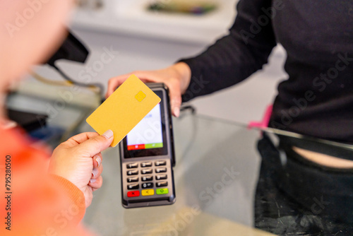 Customer paying with credit card in a hair salon
