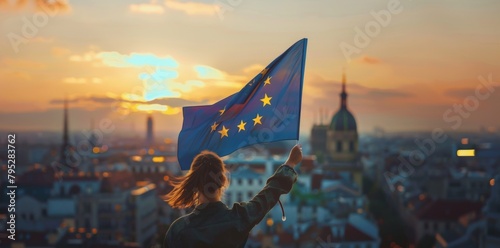Young woman holds European flag in her hands © Александер Подсадник