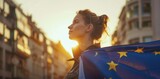 Young woman holds European flag in her hands