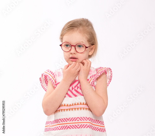 Thoughtful little girl with glasses