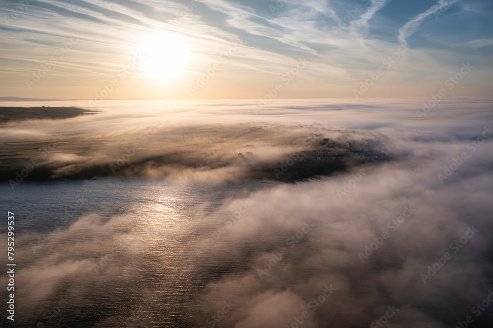 Misty sunrise over the rocky coast of Kilkee, Co. Clare. Ireland