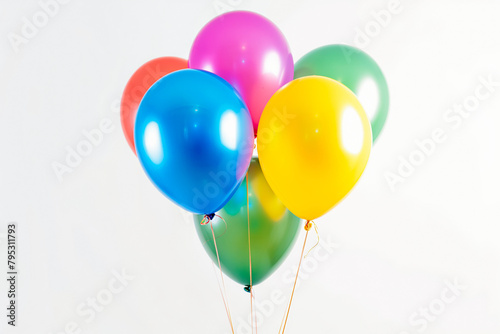 Colorful balloons in red  blue  yellow  and pink against a white background