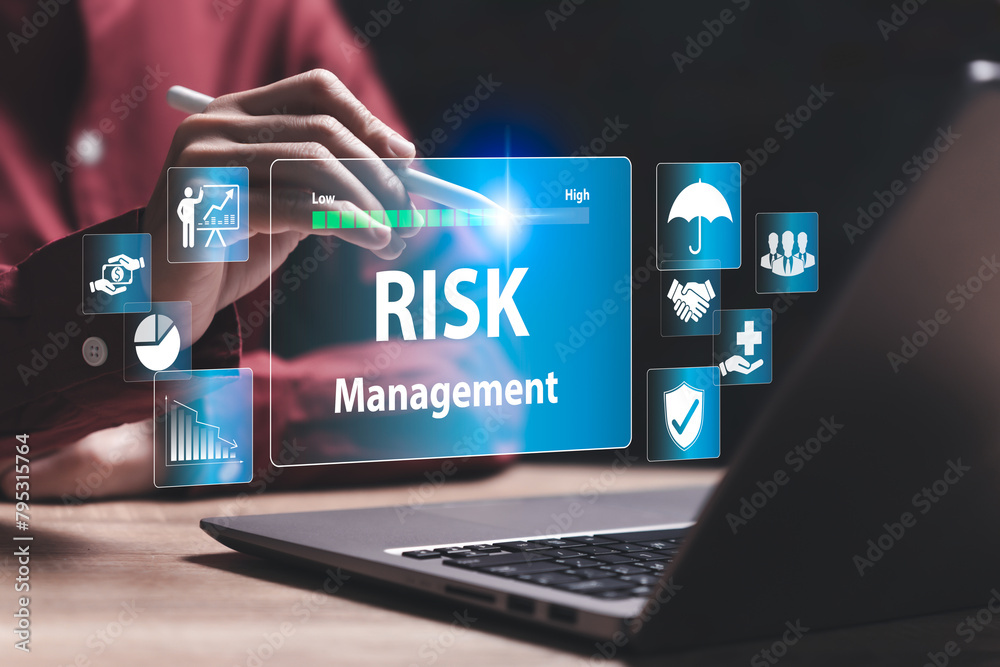 Fototapeta premium Risk management, business concept, Business Woman using laptop with a blue screen that says Risk Management. Concept of managing risks in a professional setting, business growth, Investment assessment