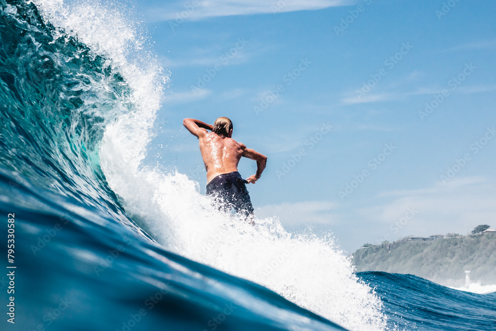 surfer on the wave in boardshorts