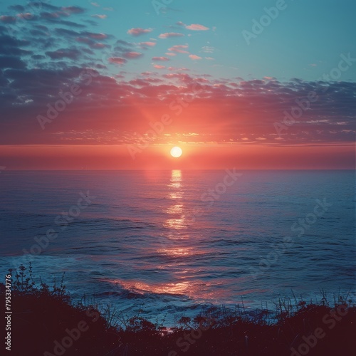 A beautiful sunset over the ocean. © Lucky_jl