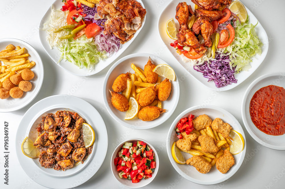 Asian food and takeaway composition from above of fried food, crab claws, plate with chicken kebabs and ingredients on white background