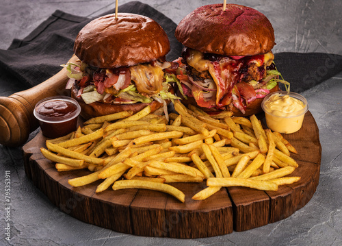 Delicious burgers with fries, sauces and additives