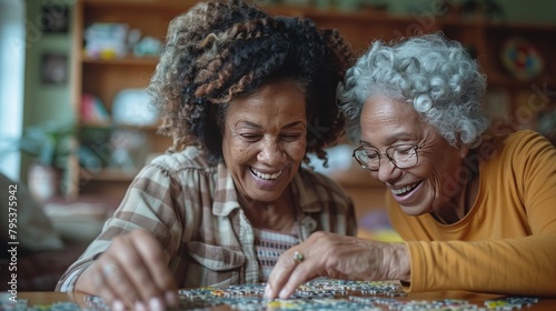 A smiling female caregiver aids a senior woman with a puzzle at home, depicting companionship and assistance. photo