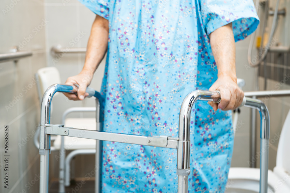 Asian elderly woman patient use walker and toilet bathroom handle security in nursing hospital, healthy strong medical. Asian elderly woman patient use walker and toilet bathroom handle security in nursing hospital, healthy strong medical.