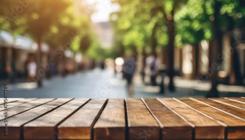 empty wooden table top with blur background of a street