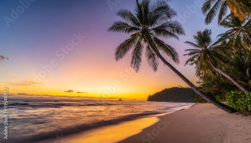 witness a breathtaking sunset casting vibrant hues over a serene tropical beach framed by swaying palm trees