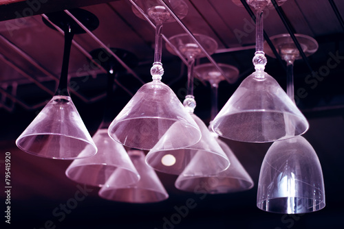 Elegant drinkware display with glass bottles hanging from ceiling