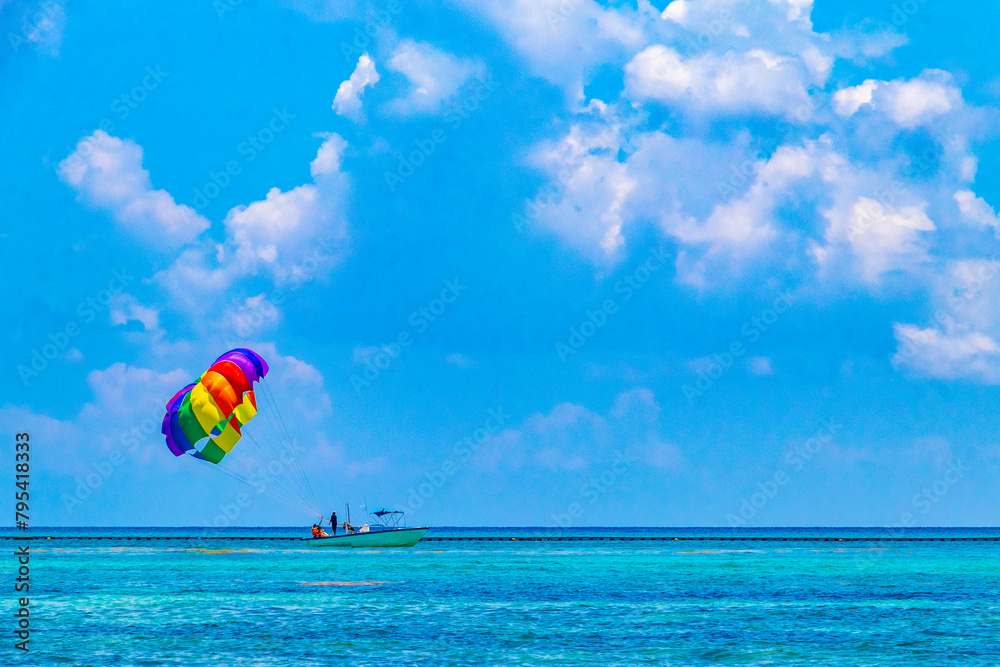 Paragliding with boat in the Caribbean in Mexico. Paragliding with boat in the Caribbean in Mexico.