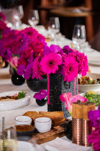 Table setting for the holiday Flowers for the holiday are red. catering