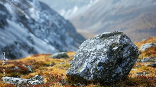 A large boulder rests in the mountains © 2rogan