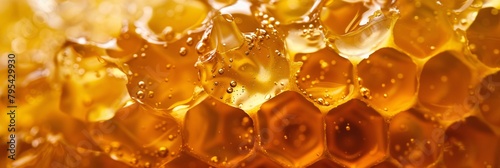 Dive into the amber depths of liquid honey, its warm tones inviting you to bask in the sweetness of nature's nectar photo