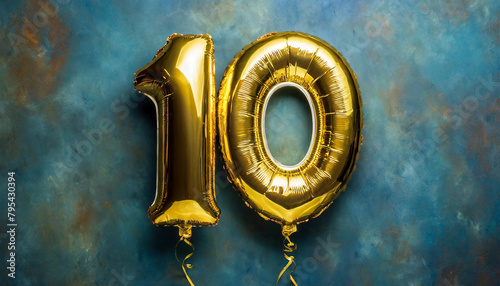 Banner with number 10 golden balloon. Ten year anniversary celebration. Bright blue background. photo