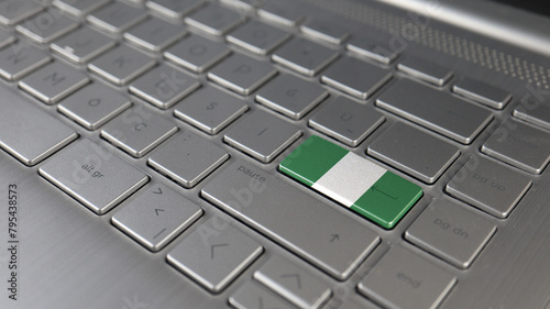 Keyboard with Nigeria flag on the enter button, represents cyber attack, learning language photo