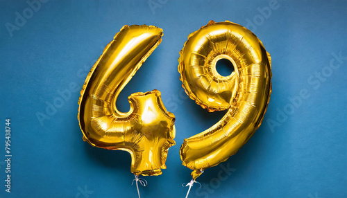 Banner with number 49 golden balloon. 49 years anniversary celebration. Bright blue background.