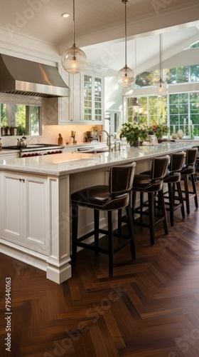 b Kitchen island with seating and hardwood flooring 