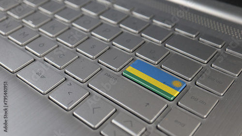 Keyboard with Rwanda flag on the enter button, represents cyber attack, learning language