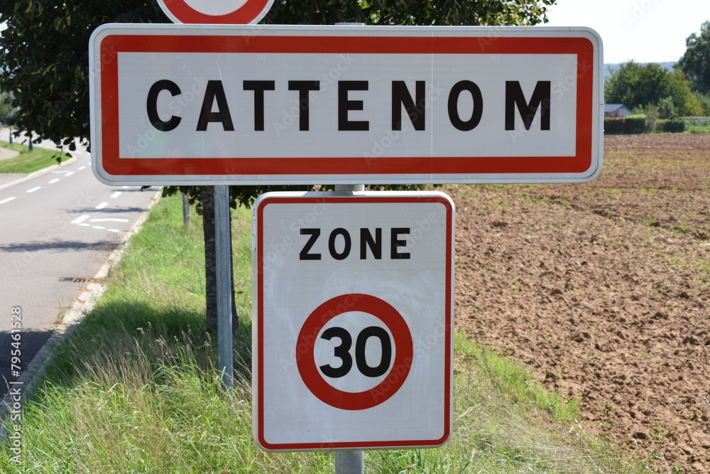 town sign of Cattenom, no overtaking, speed limit 30 town sign of Cattenom, no overtaking, speed limit 30