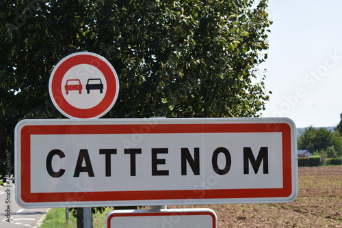 town sign of Cattenom, no overtaking, speed limit 30 photo