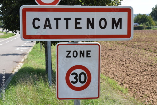 town sign of Cattenom, no overtaking, speed limit 30 photo
