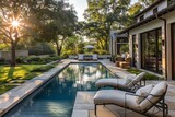 Sun-soaked backyard oasis with inviting outdoor furniture overlooking a serene pool.