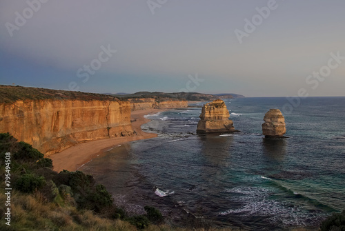 Beautiful view of the southern coast of Victoria, Australia as the last rays of sunlight turn the limestone cliffs and rock formations golden.